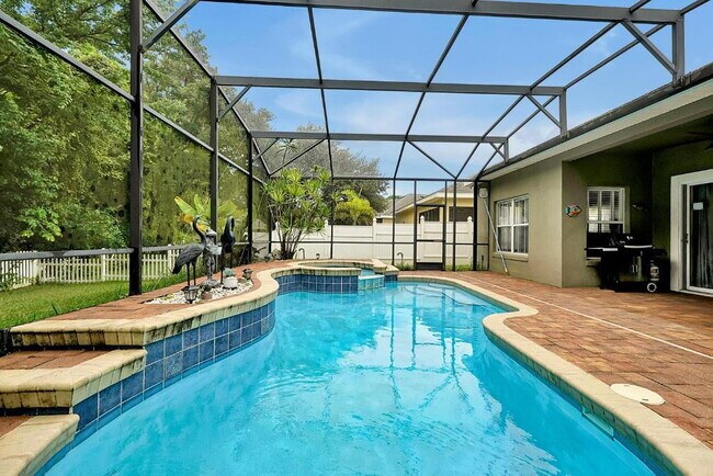 Building Photo - "Stunning 3BR Orlando Home with Private Screened Pool, Spa & Spacious Living Areas"