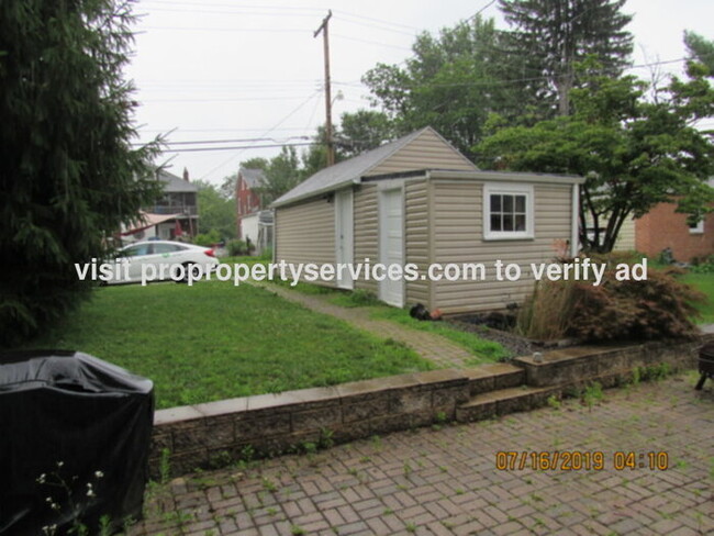 Building Photo - Charming Renovated Brick Cape Cod In Estab...