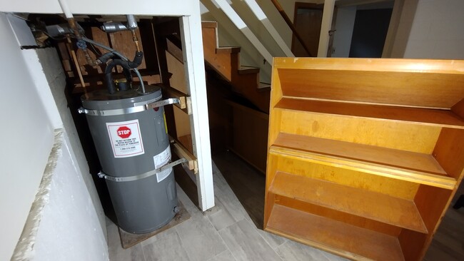 Ample roll-out storage under the stairs - 23204 64th Ave W