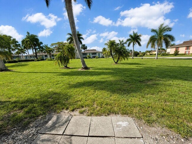 Building Photo - AVAILABLE NOW! Beautifully Renovated First-Floor Condo with Peaceful Screened Lanai