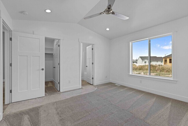 Building Photo - NEW HOME with large garage stalls and unfinished basement for additional storage