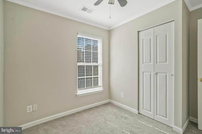 Building Photo - This beautifully maintained brick-front, three-level townhome is located in a highly sought-after...
