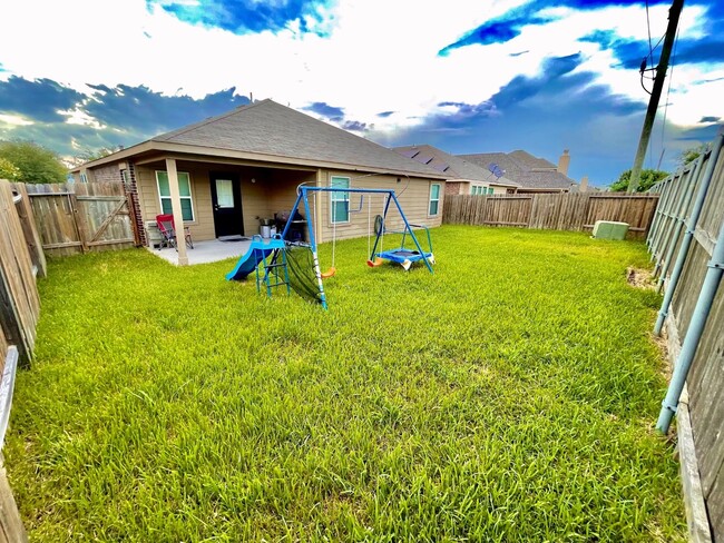 Backyard with Covered Patio Perfect for Morning Coffee - 1939 Manor Dr