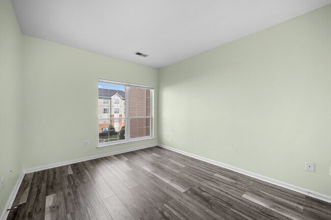 Building Photo - Two-bedroom, two-bathroom model with a den, located on the third floor.