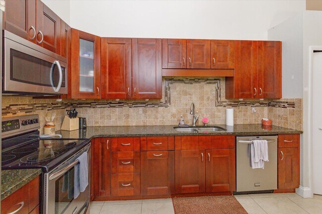 Building Photo - ? Charming Longwood Townhome with Modern Updates & Solar Power