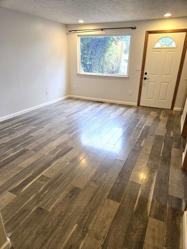 Building Photo - Large lot with tons of storage !  3 br , 2 bth + office+ 2  Car-garage + 2 Wooden Sheds