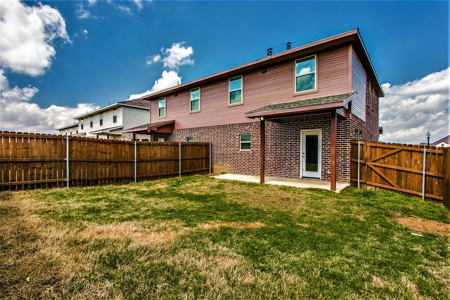 Backyard area- cedar fence and porch view - 4917 Sanger Circle