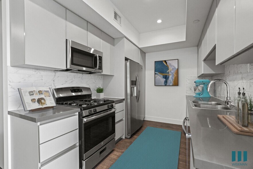 Kitchen with Stainless Refrigerator, Stove, Microwave Oven, and Dishwasher - Rosewood Heights by Wiseman