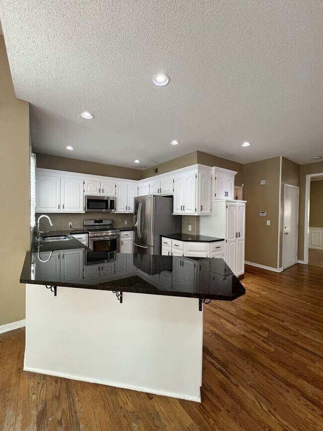 Building Photo - COMING SOON: Spacious 4-Bed Home with Fini...