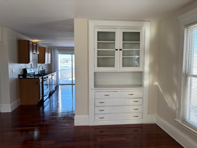 Unit 1 - living room view to kitchen - 381 Broadway