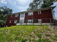 Building Photo - Top Floor Furnished Studio Apartment – All Utilities Included!