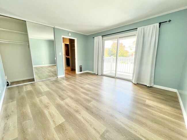 Building Photo - Contemporary 2 Bed Condo with 2 Garage Parking Spaces, Community Pool, and 3 Private Balconies