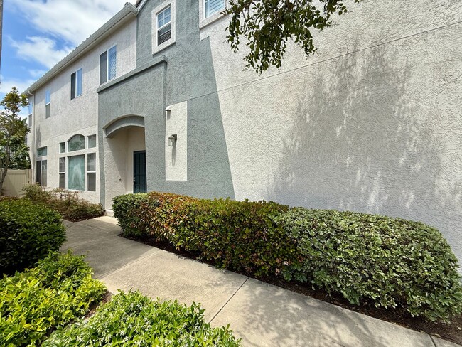 Building Photo - Spacious 3 Bedroom 2.5 Bath Townhouse with Private Garden Patio & a Community Pool/Spa! Attached ...