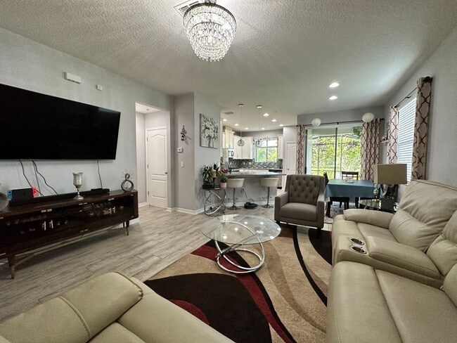 Building Photo - Lease this 3BR End-Unit Townhome in Gated Community with Water View!