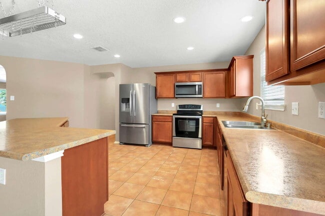 Building Photo - "Spacious 4-Bedroom Sanctuary with 3 Full ...