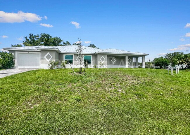 Building Photo - Spacious 3BR/2BA Duplex in Lehigh Acres & $500 Off Your First Month If You Apply by Aug 20th!