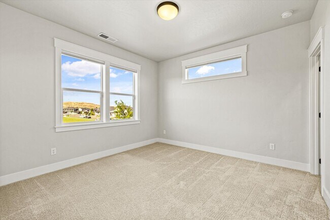 Building Photo - Luxury 4-Bedroom Home for Rent in Dry Cree...