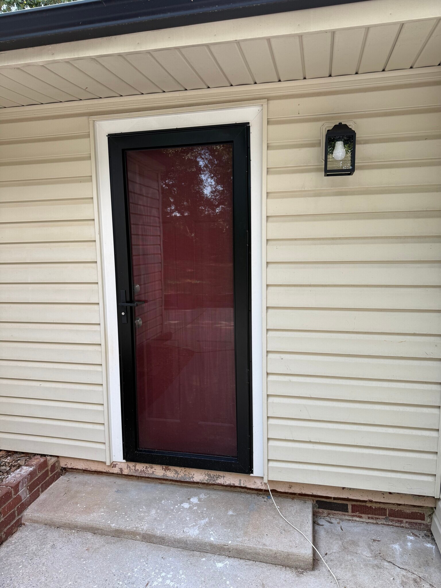 Storm Door helps to insulate house and gives a clear view of backyard - 18 Waters Ave