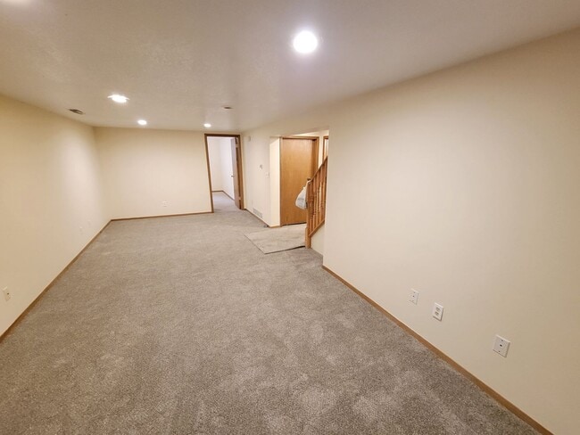 Building Photo - 4 BD, 2 BA - FENCED IN YARD, PRIVATE TRAILS, FINISHED UPPER AND LOWER LIVING AREAS, ATTACHED GARAGE!