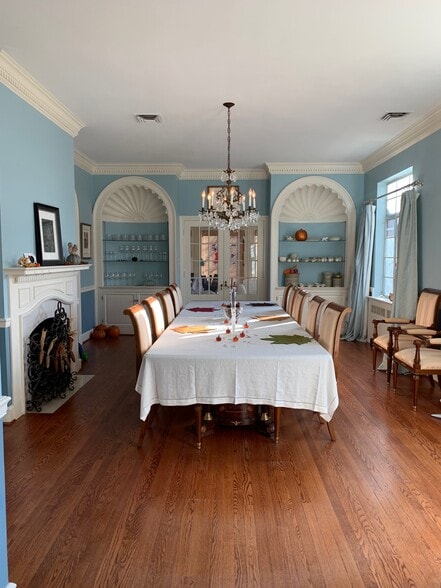 Formal dining room - showing how a table that seats 12 fits easily. - 5553 Little Falls Rd