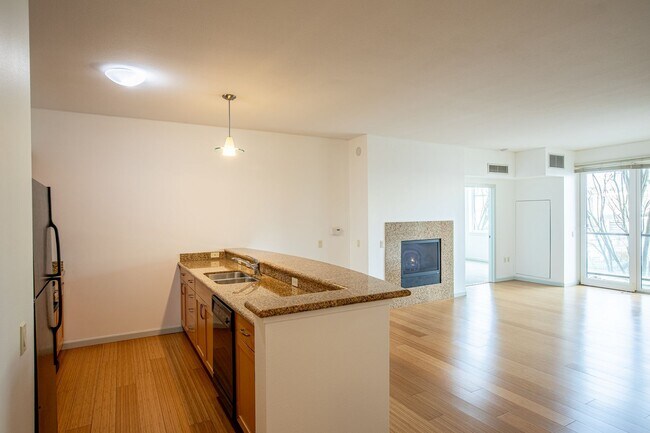 Building Photo - Sweet + secure 1/1 condo with parking, extra storage room + AC available now!