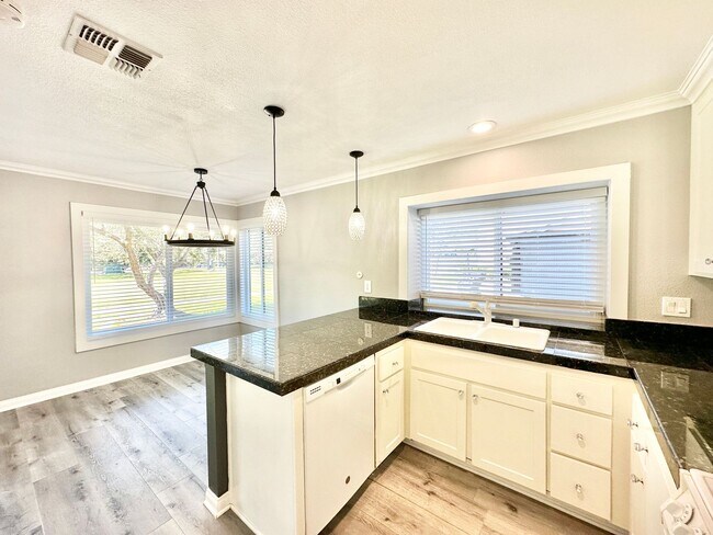 Building Photo - Beautiful, End-Unit, Ground Level, Largest SF 1/1 layout in the Pala Mesa Villas Community with G...