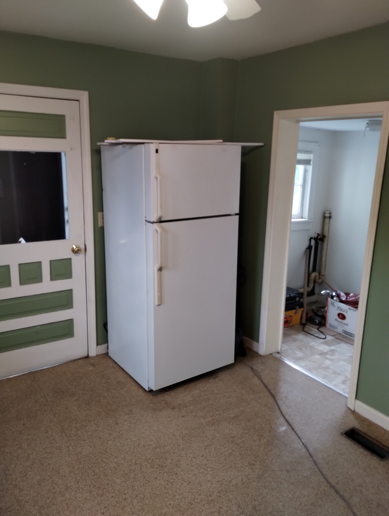 Kitchen with adjoining laundry area - 5025 Clinton Street Rd