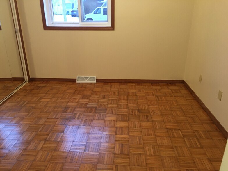 Bedroom 1 Features Parkay Flooring - 4251 Brockley Ave