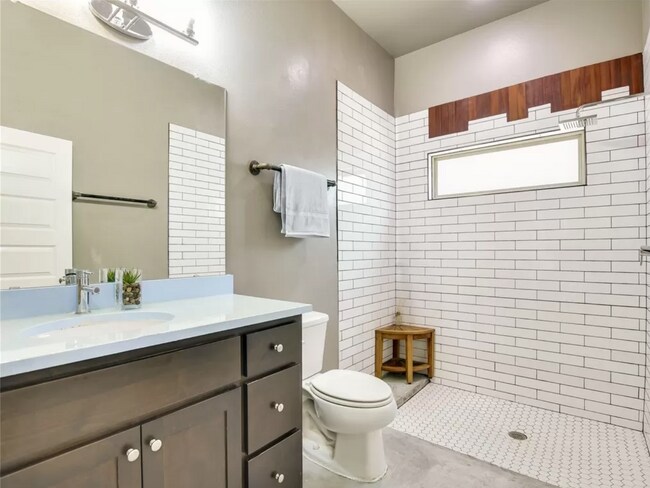 Downstairs full bath with rain shower - 2203 E 14th St