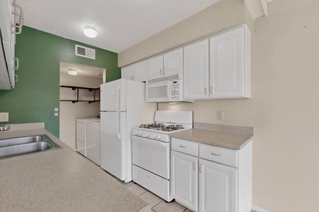 Building Photo - NE Affordable 2/BD 1/BA 1/CG 2nd Story NE Condo *The Pool is now Open*