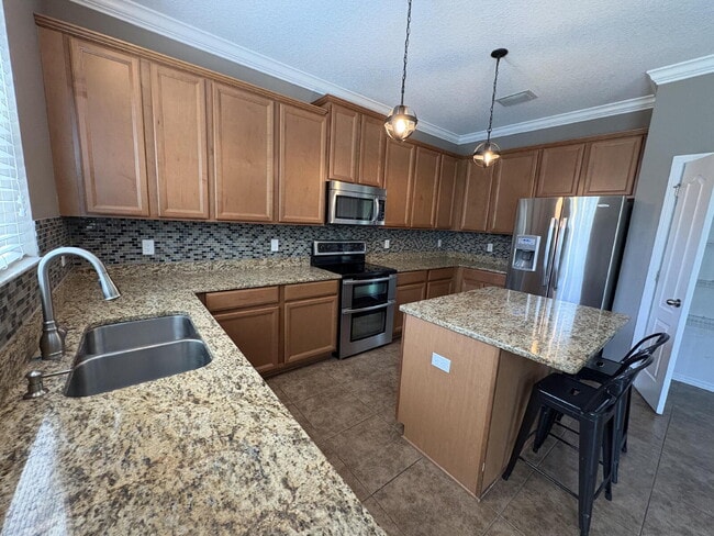 Building Photo - Spacious 5-Bedroom Pool Home with Putting ...