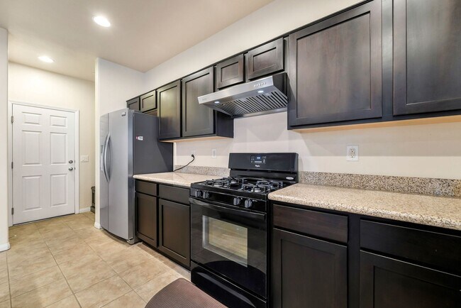 Building Photo - Stylish Two-Story Retreat with Designer Kitchen, Private Backyard & Flexible Living Space!