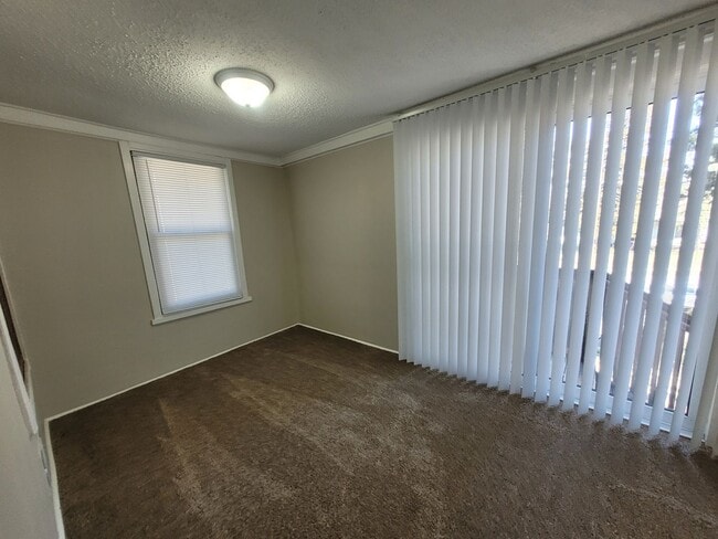 Building Photo - Four bedroom home on Indianola Ave with large yard and two decks!