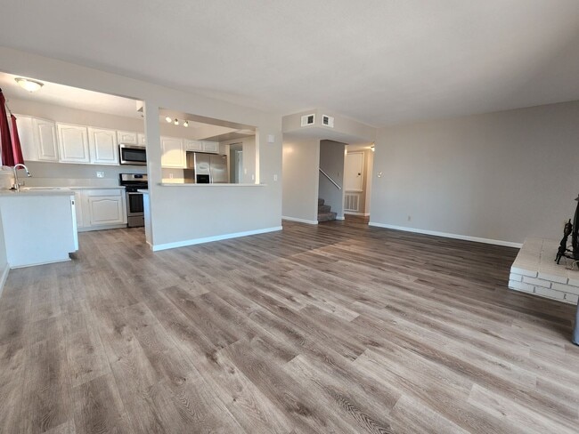 Building Photo - 4 Bedroom Two-Story Home with Downstairs Primary Bedroom & Fireplace