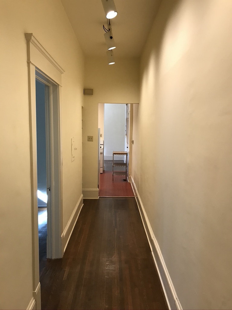 Hallway toward kitchen; Bedroom to left - 18 Avery Dr NE