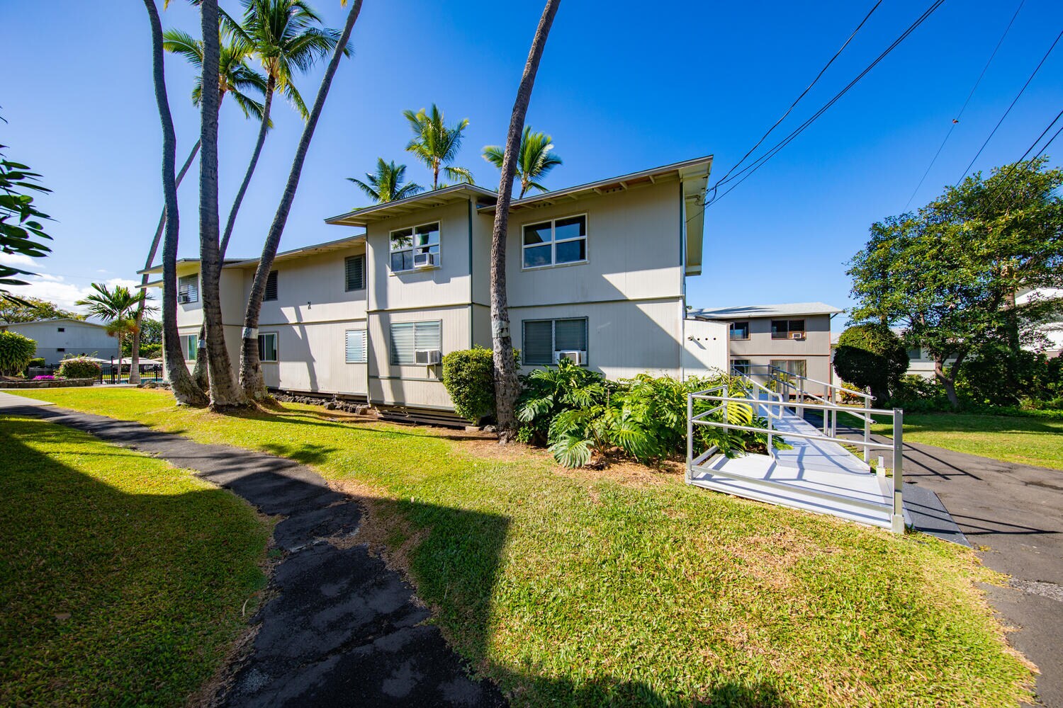 view as you walk up from the parking lot (you get 1 spot for the unit) - 74-5618 Palani Rd