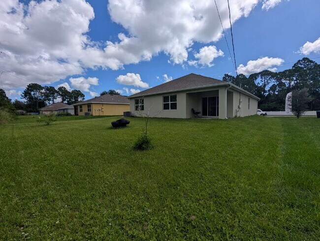 Building Photo - Modern 4-Bedroom Home with Large Backyard in Quiet SW Palm Bay – Available Mid-June