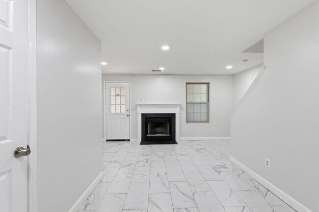 Building Photo - Experience contemporary living in this beautifully renovated residence where modern design meets ...