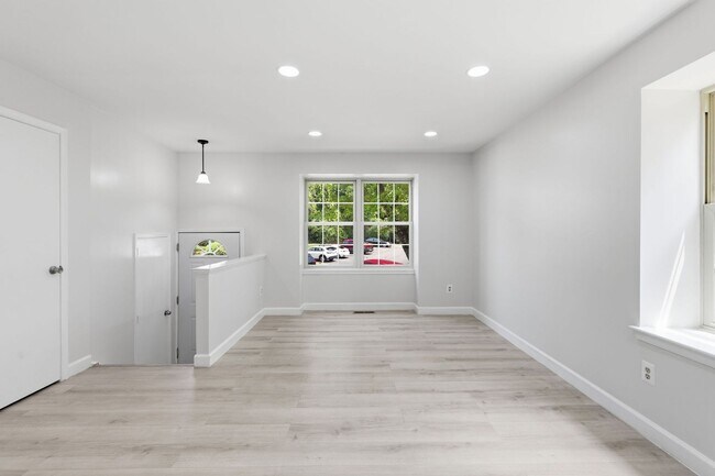 Building Photo - Experience contemporary living in this beautifully renovated residence where modern design meets ...
