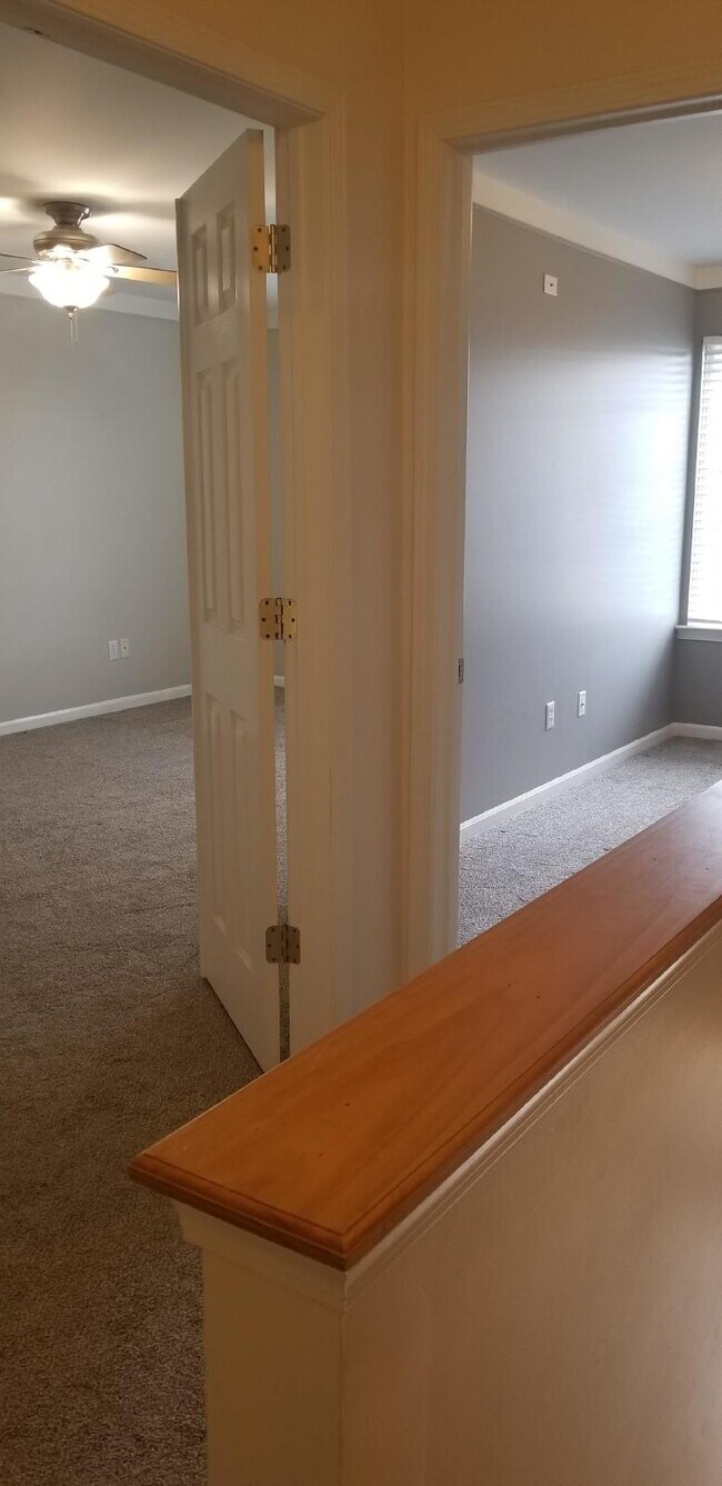 Building Photo - 2 Bedroom, 1.5 Bath Townhouse w/ Garage & Huge Master Bedroom. Full Sized Washer & Dryer In Unit.