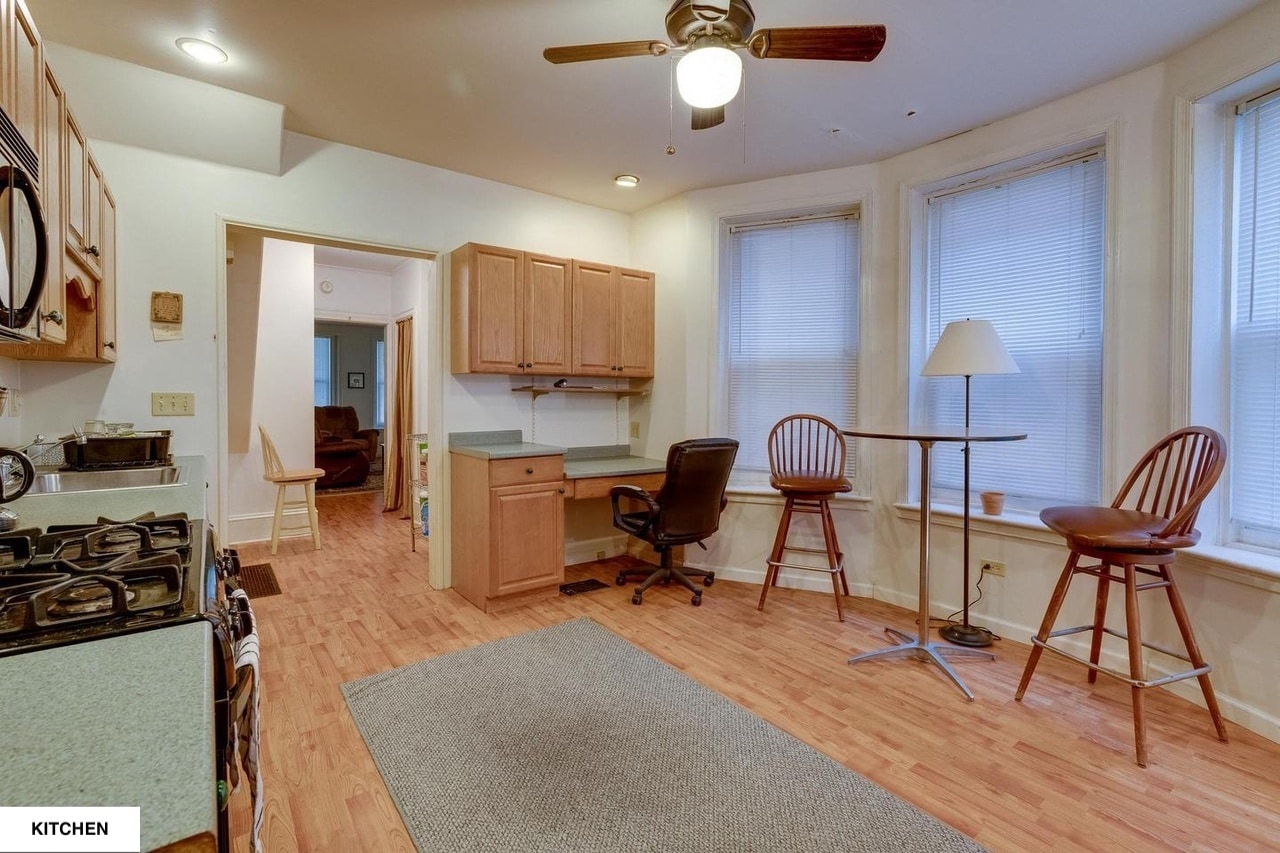 Kitchen with bay windows and room room for dining table or cafe table. - 513 1/2 W James St