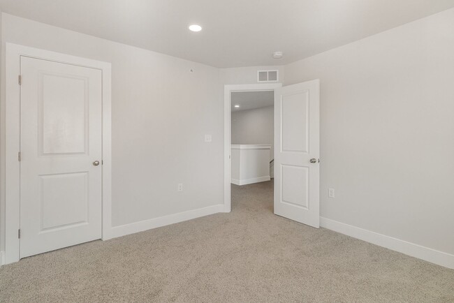 Building Photo - Modern 2025 Townhome | Open-Concept Living, Chef’s Kitchen with Large Island & 2-Car Garage