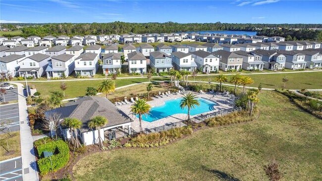 Building Photo - Like-New 4 Bedroom 3 Bath with Pond View & Two Living Spaces — Minutes to South Lake Nona