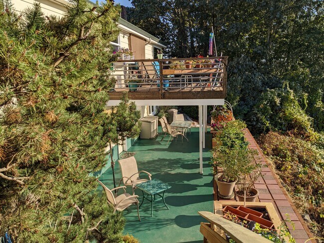 This view from the top of the stairs to the apartment shows the spacious outdoor living area. - 8261 Northrop Plz SW