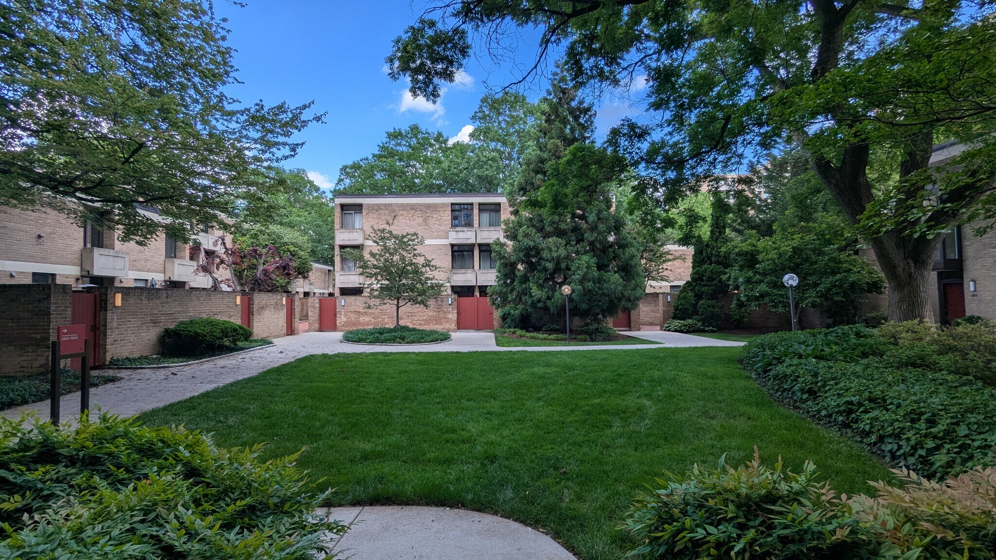 Property includes manicured gardens, wide lawns, and courtyards. - 490 M St SW