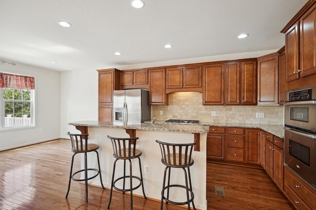 Building Photo - This beautiful townhome spans three finished levels and over 2800 square feet.