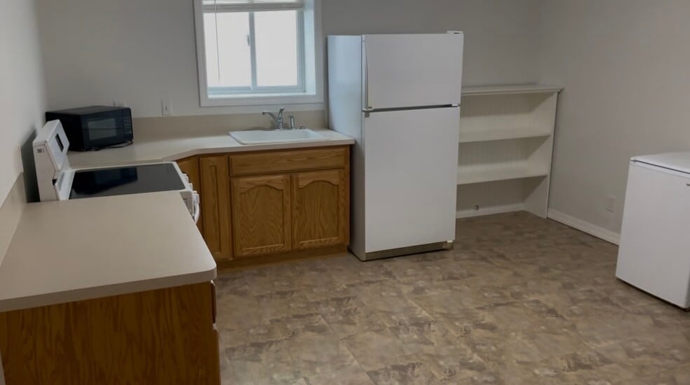 Large kitchen with range, refrigerator and microwave. - 164 Rosewood Dr