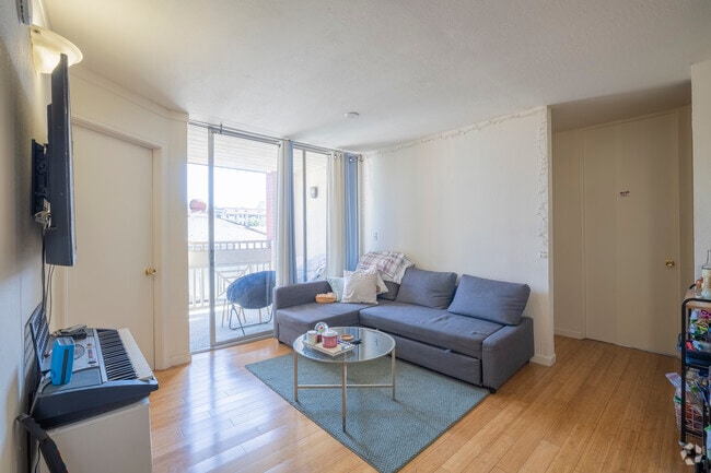 4BR, 1BA - 1000 SF - Living Room - Channing Campus Apartments