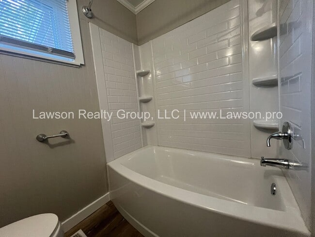 Building Photo - Charming Brick Ranch with Beautifully Landscaped Yard and Attached Carport