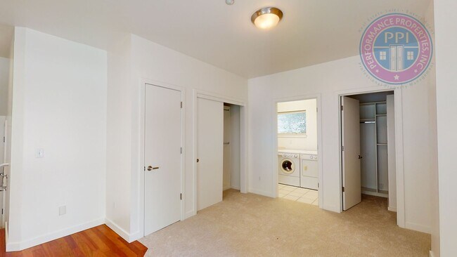 Building Photo - Riverfront Location, Luxury Townhome - End Corner Unit, Two En-Suites, Attached Garage